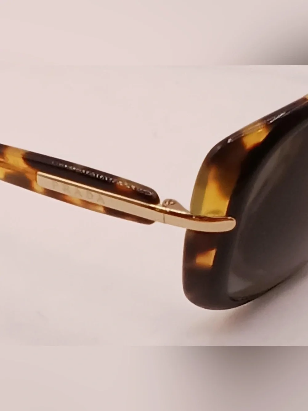 Prada Tortoiseshell Frame Sunglasses with Dark Gray Lenses
